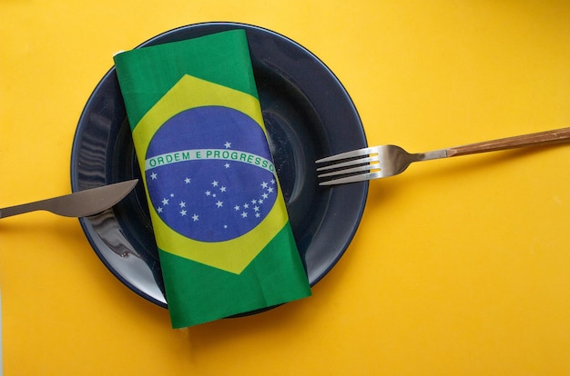 Empty plate with cutlery with brazilian flag