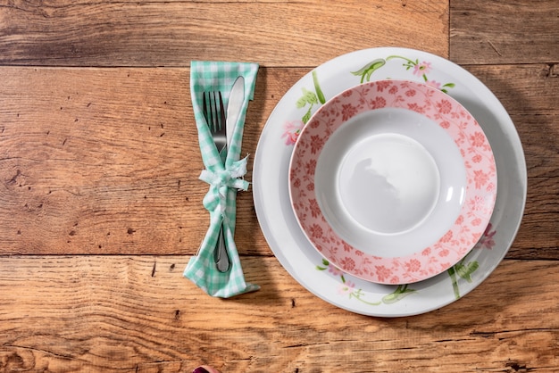 Empty plate on wooden table top view