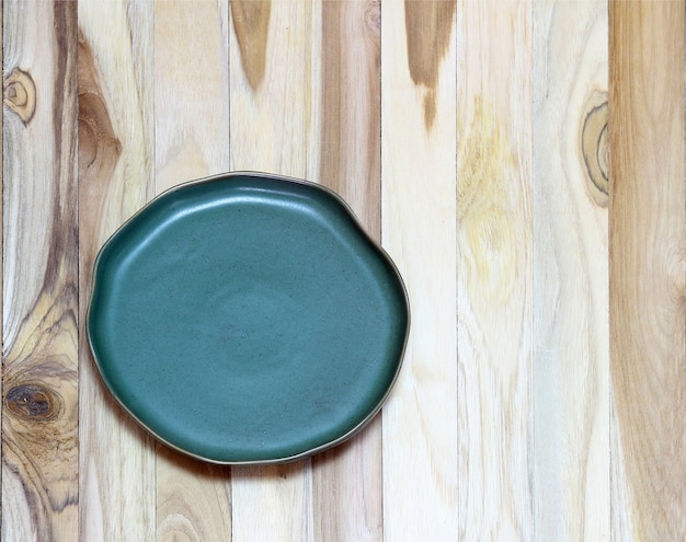 Empty plate on wooden table