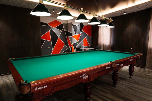 empty pool table in billiard room