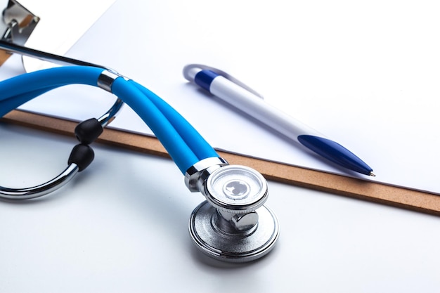 Empty prescription lying on table with stethoscope