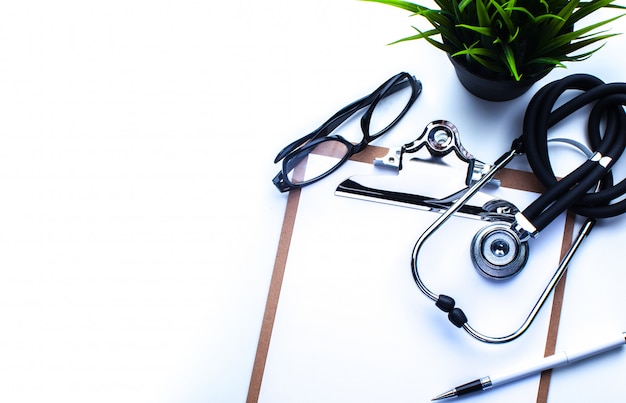 Empty prescription  lying on table with stethoscope