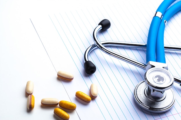 Empty prescription  lying on table with stethoscope