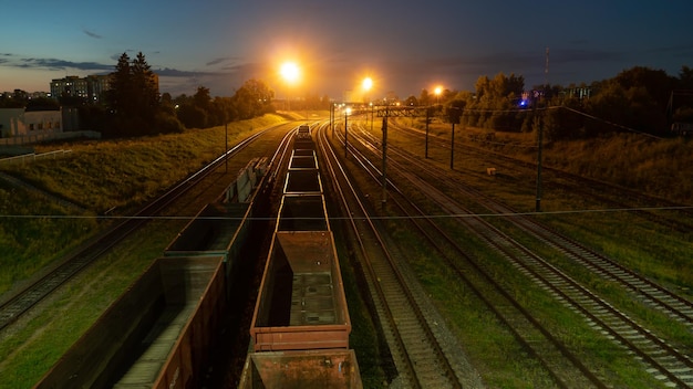 Empty railway wagons for cargo transportation top view A place for storage repair and maintenance of freight railcars Logistics transportation of bulk materials coal crushed stone sand