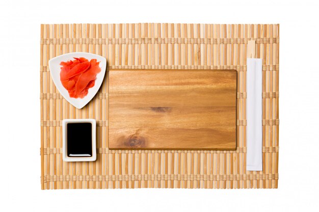 Empty rectangular brown wooden plate with chopsticks for sushi