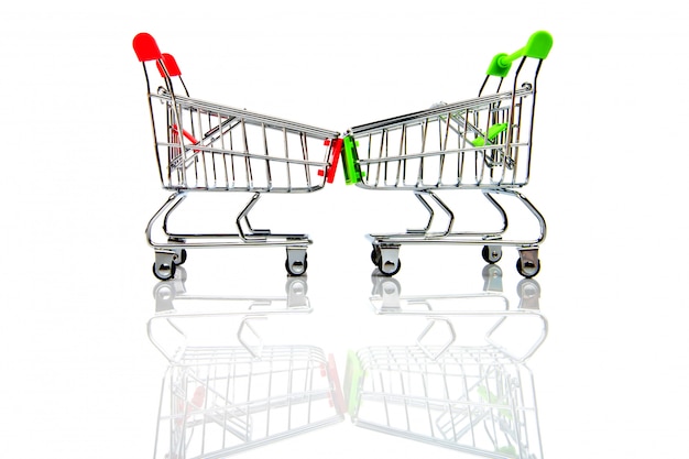 empty red and green shopping cart isolated on white