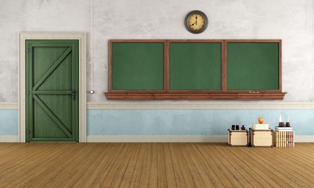 Empty retro classroom with old door and blackboard