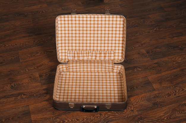 Empty retro suitcase on the floor.