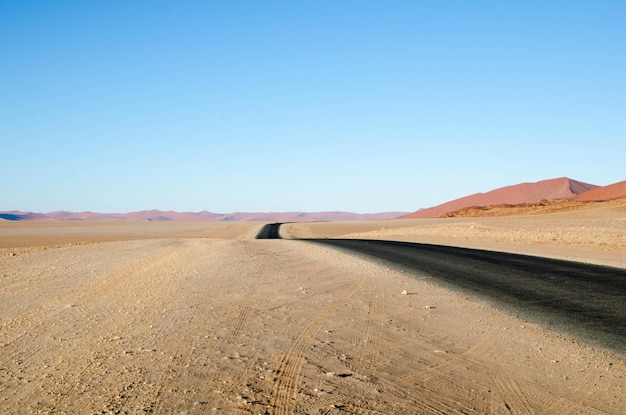 empty road against clear sky at namib desert