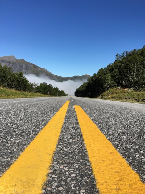 Empty road against clear sky