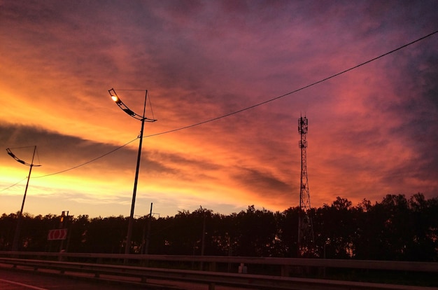 empty road against orange sky