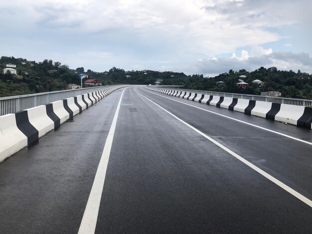 Empty road against sky