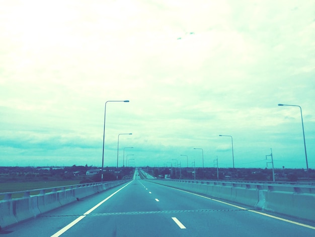 Empty road along landscape