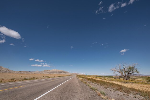 Empty road along landscape