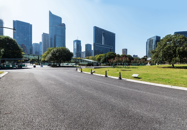 Empty road floor surface with modern city landmark buildings in China