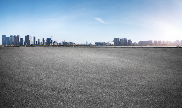 Empty road floor surface with modern city landmark buildings in China