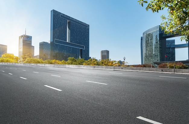 Photo empty road floor surface with modern city landmark buildings in china