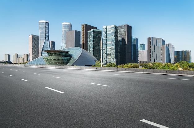 Empty road floor surface with modern city landmark buildings in China