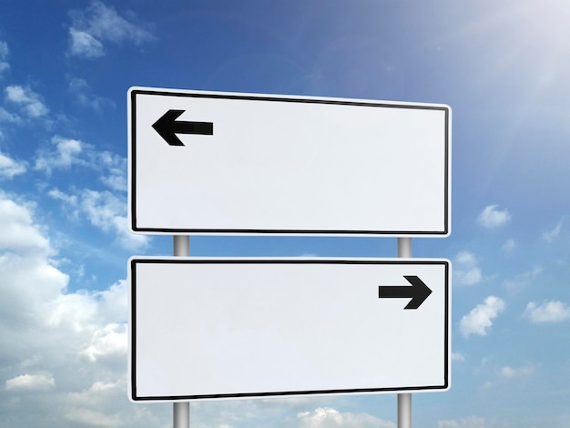 Empty road sign against a background of blue sky with clouds