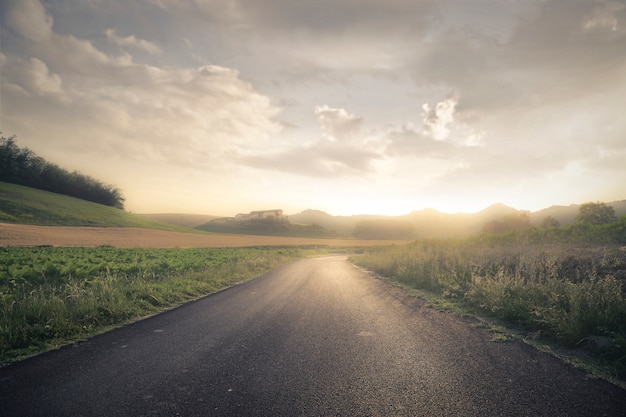 Empty road in sunset