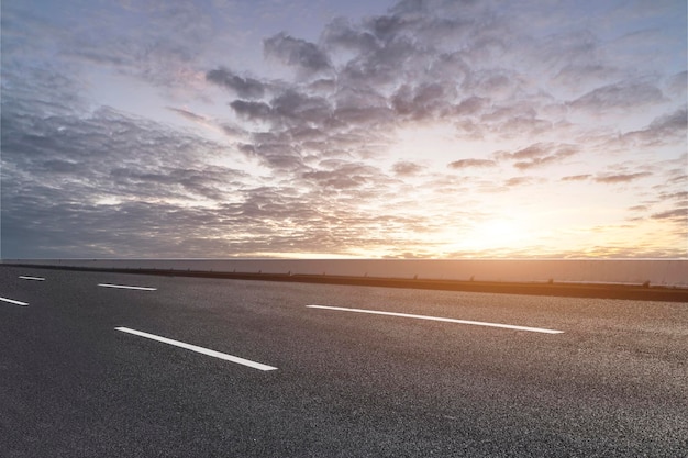 Empty road with panoramic cityscape