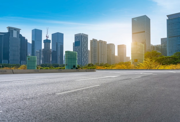 Empty road with panoramic cityscape