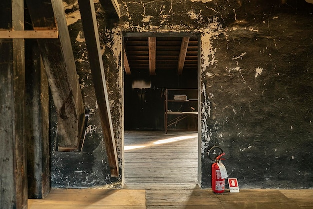 Empty room in an abandoned house with window and wooden floor