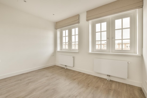 Empty room, flat with a ceiling, parquet floor, and white walls