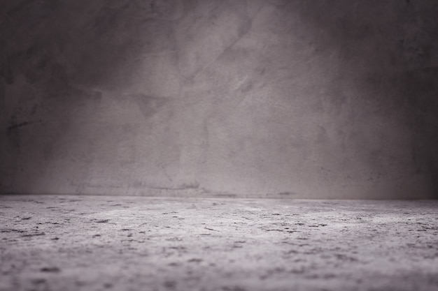 Empty room with concrete wall, grey background.