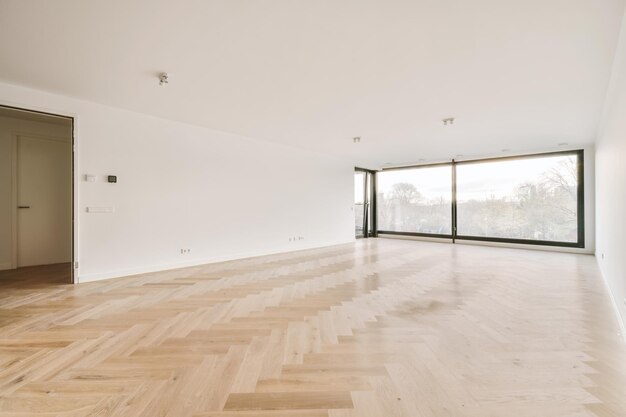 Empty room with door and parquet floor