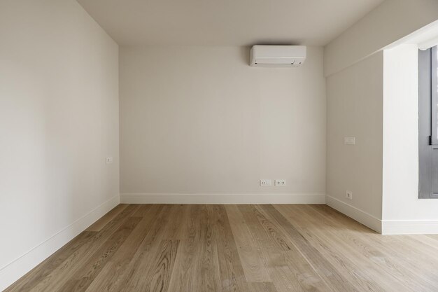 Empty room with offwhite painted walls