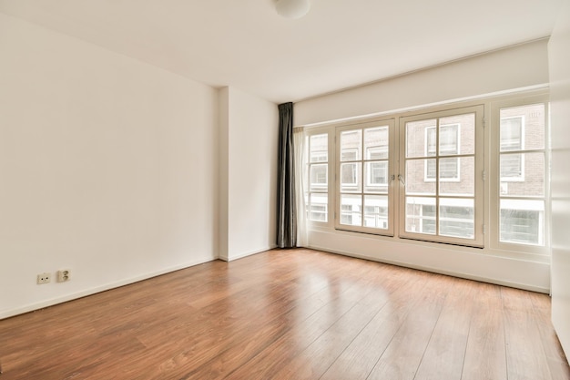 Empty room with panoramic window and radiator