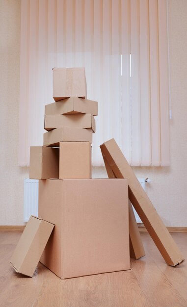 Empty room with stack of cartons moving house concept