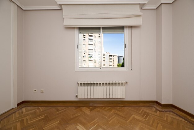 Empty room with a white aluminum window with a view