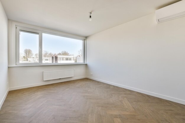 Empty room with window and radiator