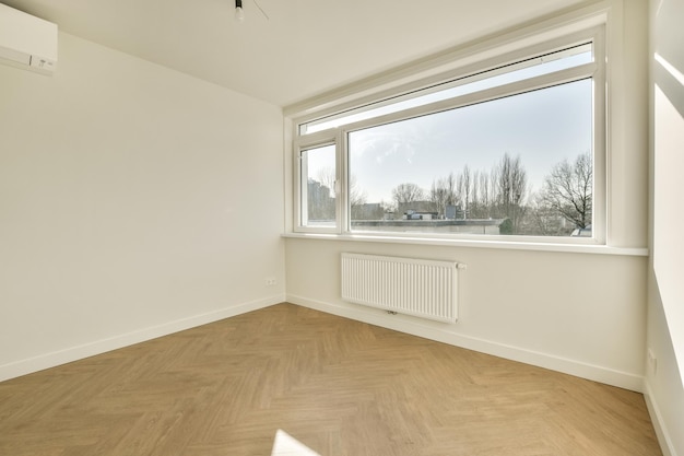 Empty room with window and radiator