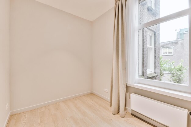 Empty room with window and radiator