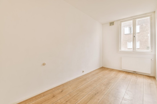 Empty room with window and radiator