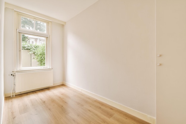 Empty room with window and radiator