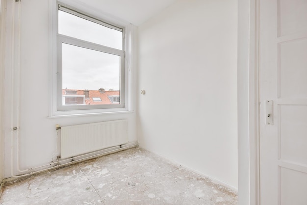 Empty room with window and radiator