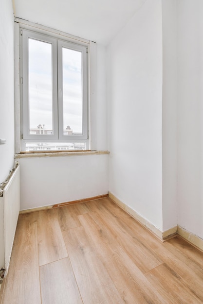 Empty room with window and radiator