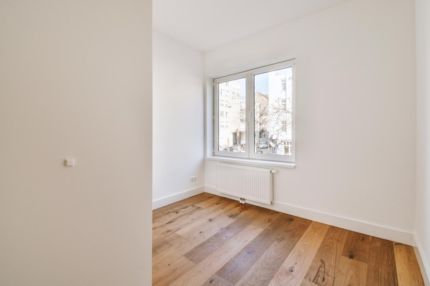 Empty room with window and radiator