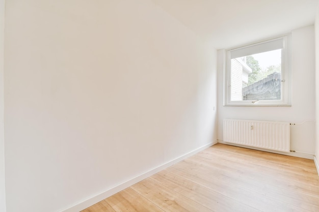 Empty room with window and radiator