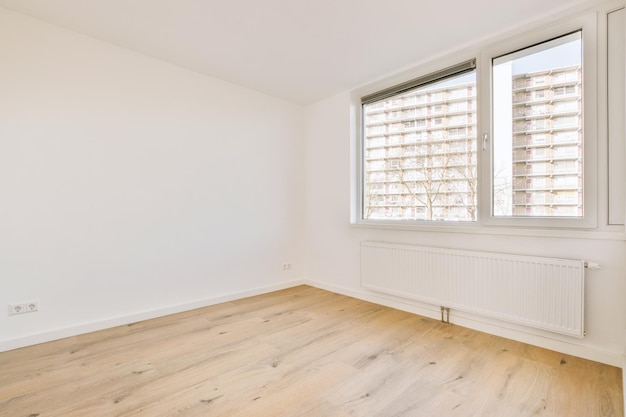 Empty room with window and radiator