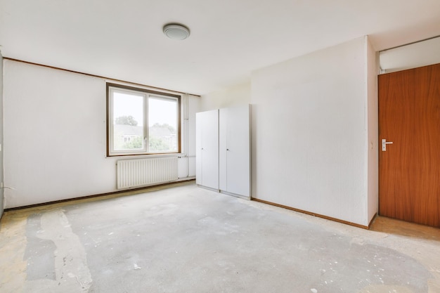 Empty room with window and radiator