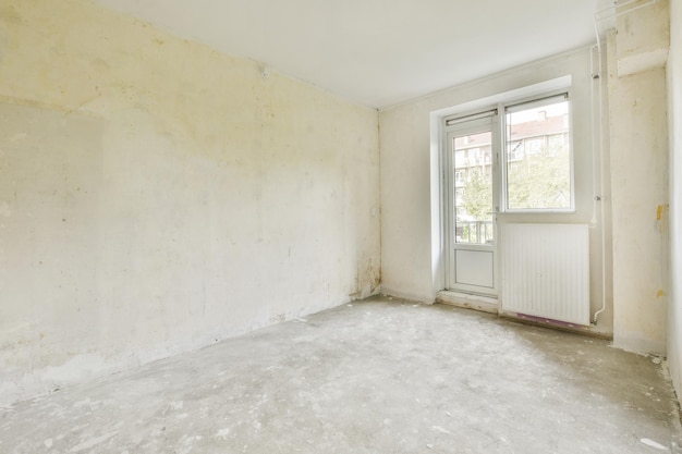 Empty room with window and radiator