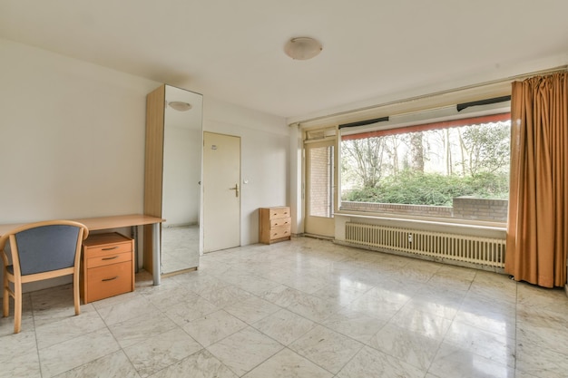 Empty room with window table and radiator