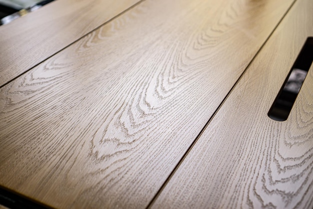 Empty rough wooden table top in the dark room