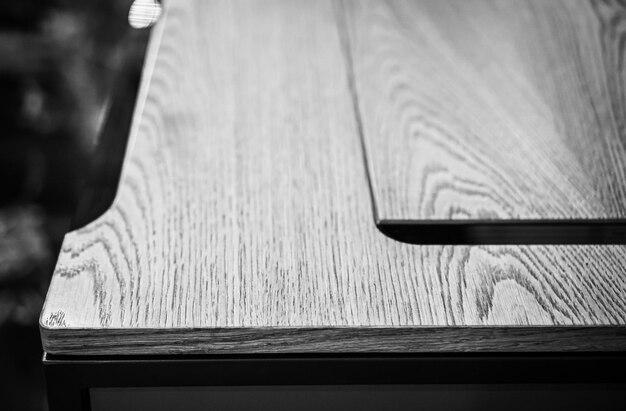 Empty rough wooden table top in the dark room