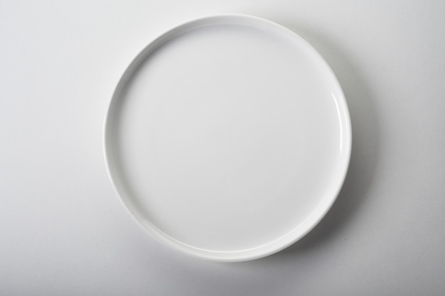 Empty round white ceramic plate